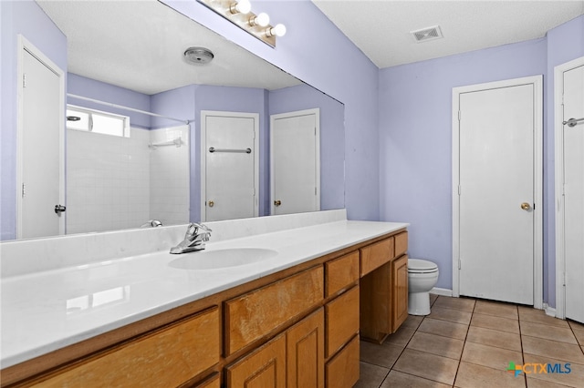 4209 Stallion Dr, Killeen, TX 76549 - bathroom with vanity, toilet, a shower, and tile patterned floors