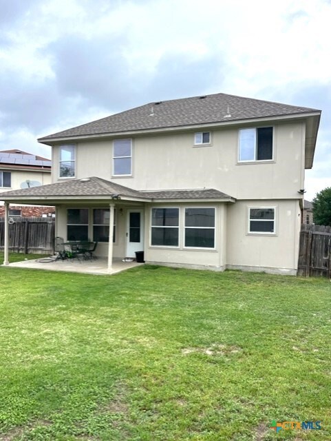 5408 Donegal Bay Ct, Killeen, TX 76549 - back of property featuring a shingled roof, a patio, and stucco siding