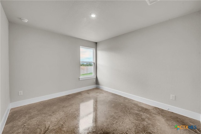 2402 Healy Dr, Temple, TX 76502 - spare room with concrete floors, a smoke detector, and baseboards