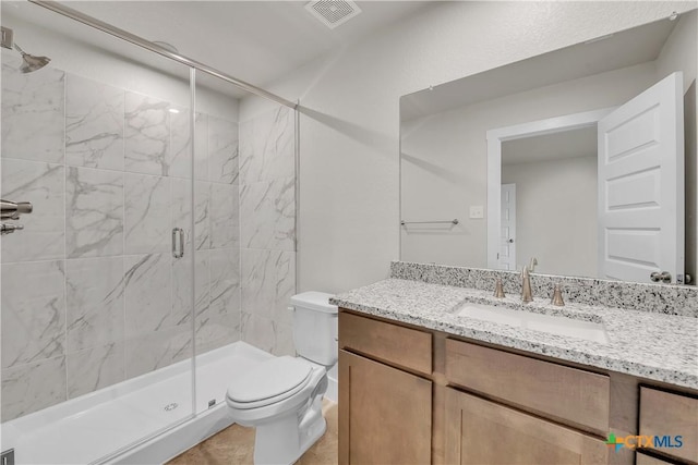 2402 Healy Dr, Temple, TX 76502 - bathroom featuring toilet, a stall shower, and vanity
