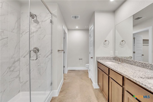 2402 Healy Dr, Temple, TX 76502 - full bath featuring a shower stall, recessed lighting, double vanity, and toilet