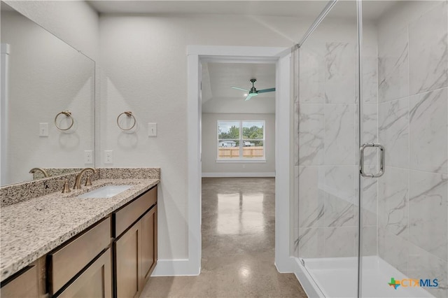 2402 Healy Dr, Temple, TX 76502 - bathroom with baseboards, a stall shower, vanity, and a ceiling fan