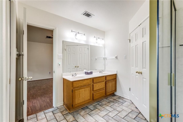 1812 Bowen Ave, Copperas Cove, TX 76522 - full bathroom featuring double vanity and baseboards