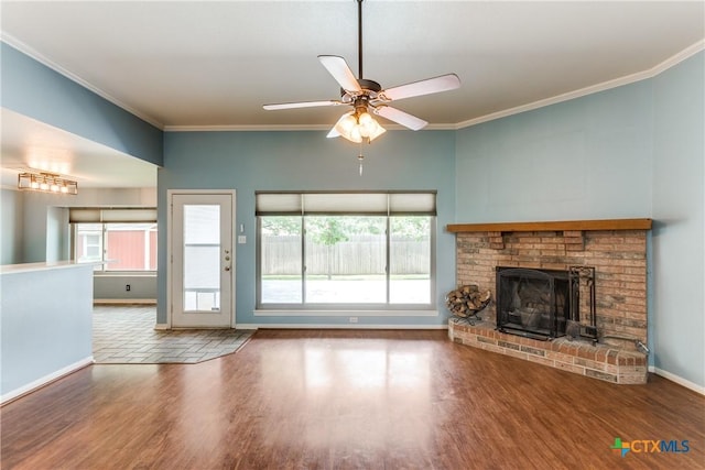 1812 Bowen Ave, Copperas Cove, TX 76522 - unfurnished living room featuring wood finished floors, baseboards, a brick fireplace, ceiling fan, and ornamental molding