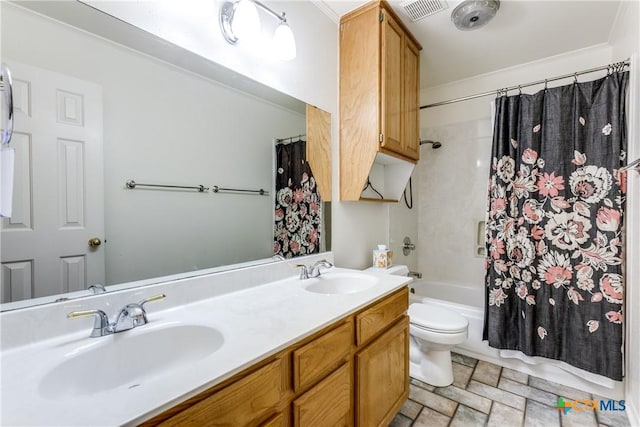 1812 Bowen Ave, Copperas Cove, TX 76522 - full bath with toilet, double vanity, stone finish floors, shower / bathtub combination with curtain, and ornamental molding
