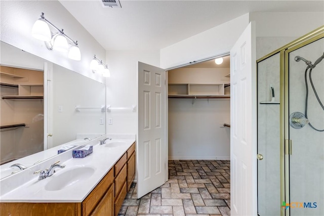 1812 Bowen Ave, Copperas Cove, TX 76522 - bathroom with double vanity, a spacious closet, and a shower stall
