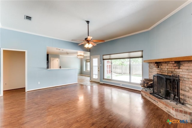 1812 Bowen Ave, Copperas Cove, TX 76522 - unfurnished living room with crown molding, a fireplace, a ceiling fan, wood finished floors, and baseboards