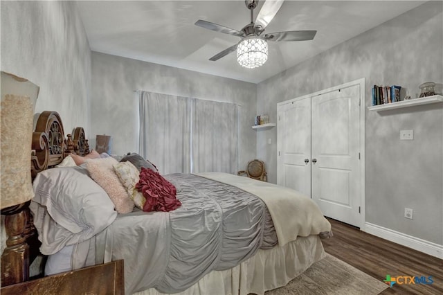 bedroom featuring ceiling fan and dark wood-type flooring