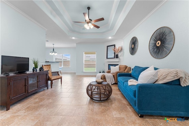 2655 Belle Hubbard Trl, Belton, TX 76513 - living room featuring ceiling fan, ornamental molding, a tray ceiling, recessed lighting, and a fireplace