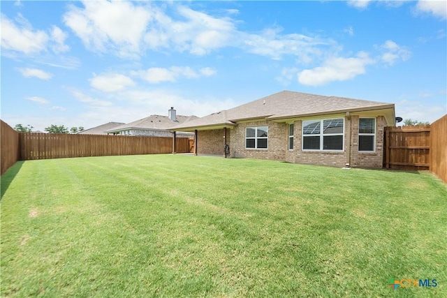 2655 Belle Hubbard Trl, Belton, TX 76513 - rear view of property with a fenced backyard and brick siding