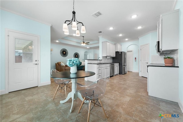 2655 Belle Hubbard Trl, Belton, TX 76513 - dining area featuring crown molding, recessed lighting, a chandelier, a ceiling fan, and light stone finish floors