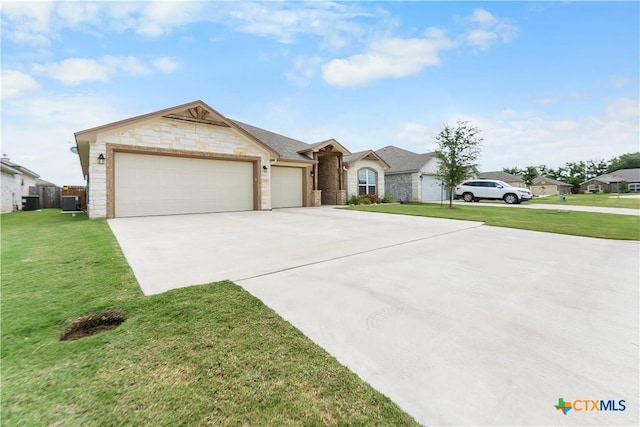 2655 Belle Hubbard Trl, Belton, TX 76513 - view of front facade with a garage, driveway, a front yard, and stone siding