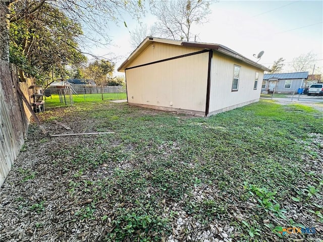 view of home's exterior featuring a lawn