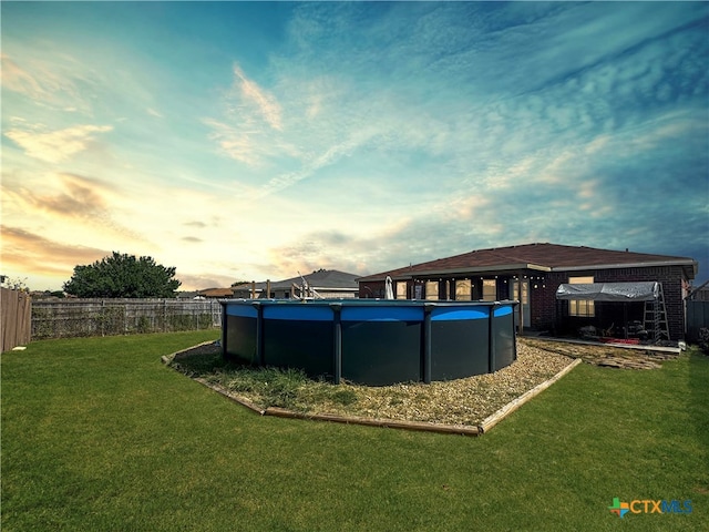 exterior space featuring a fenced in pool