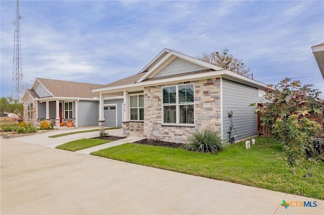 craftsman-style home featuring a garage and a front lawn