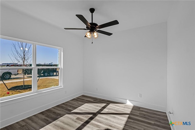 unfurnished room featuring dark hardwood / wood-style flooring and ceiling fan