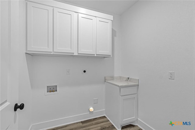 laundry area featuring cabinets, washer hookup, hookup for an electric dryer, and dark wood-type flooring