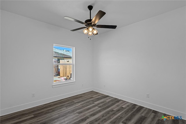 empty room with dark hardwood / wood-style floors and ceiling fan