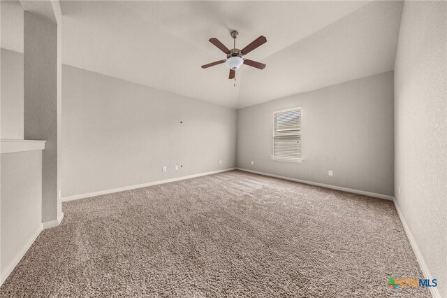 4703 Prewitt Ranch Rd, Killeen, TX 76549 - spare room with a ceiling fan, carpet, vaulted ceiling, and baseboards