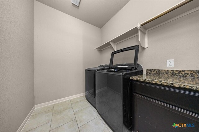 4703 Prewitt Ranch Rd, Killeen, TX 76549 - washroom with washing machine and clothes dryer, baseboards, and light tile patterned flooring
