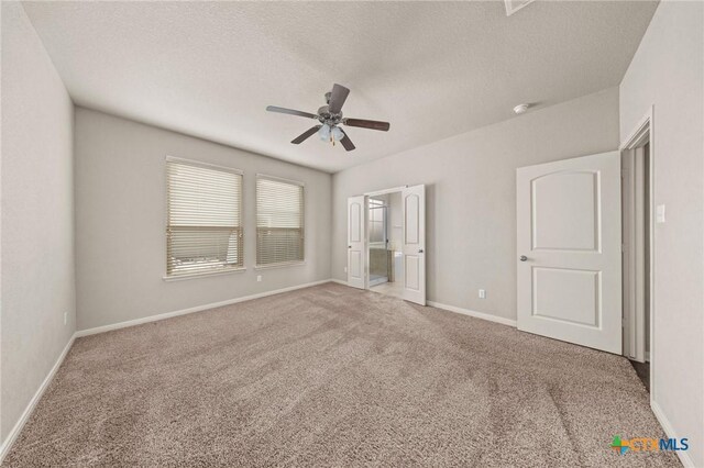 4703 Prewitt Ranch Rd, Killeen, TX 76549 - unfurnished bedroom with carpet floors, a textured ceiling, baseboards, ensuite bath, and ceiling fan