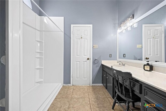 4818 Bramblewood Dr, Killeen, TX 76542 - bathroom with vanity, a shower, and tile patterned floors