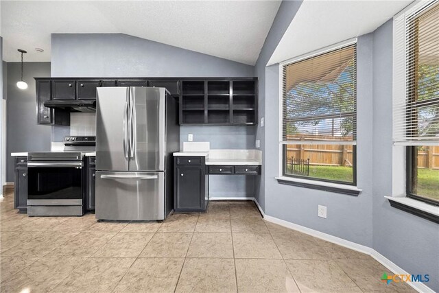 4818 Bramblewood Dr, Killeen, TX 76542 - kitchen with stainless steel appliances, dark cabinetry, under cabinet range hood, vaulted ceiling, and light countertops