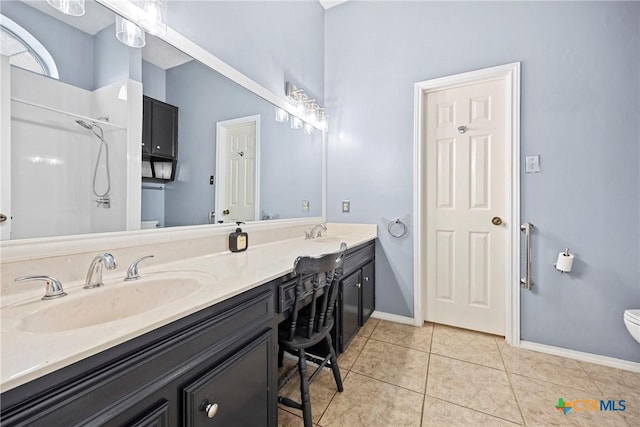4818 Bramblewood Dr, Killeen, TX 76542 - full bath featuring double vanity, tile patterned floors, and a shower