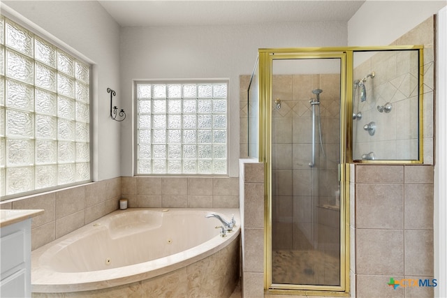 bathroom featuring independent shower and bath and vanity