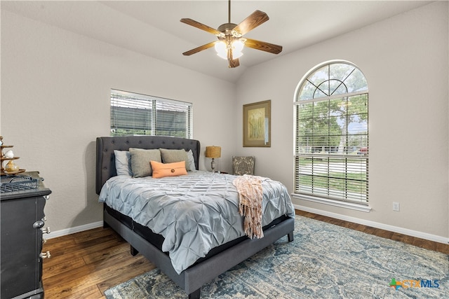 bedroom featuring dark wood-type flooring, ceiling fan, and lofted ceiling