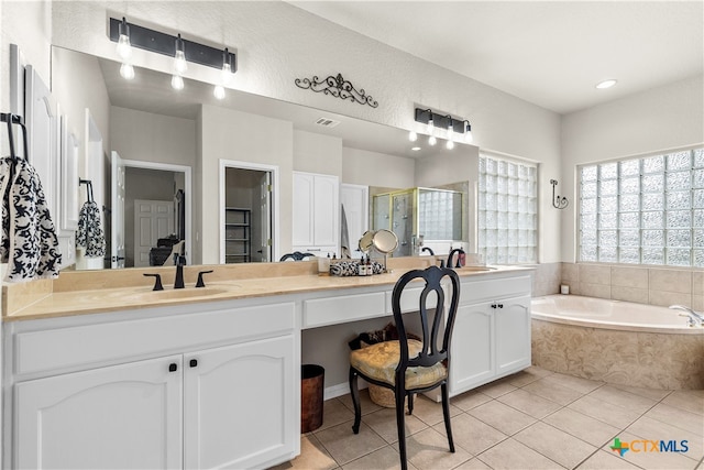 bathroom featuring separate shower and tub, vanity, and tile patterned floors