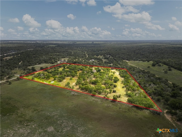 birds eye view of property featuring a rural view