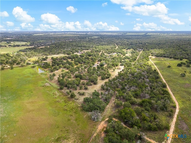 birds eye view of property with a rural view