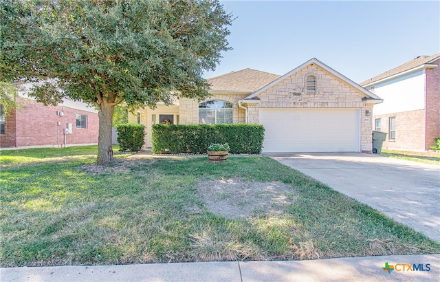 view of front of house featuring a garage and a front yard