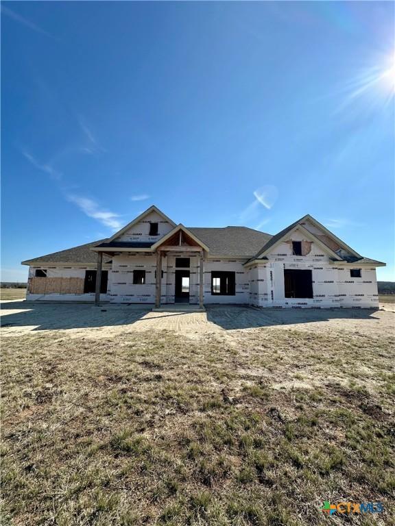 unfinished property with a front yard