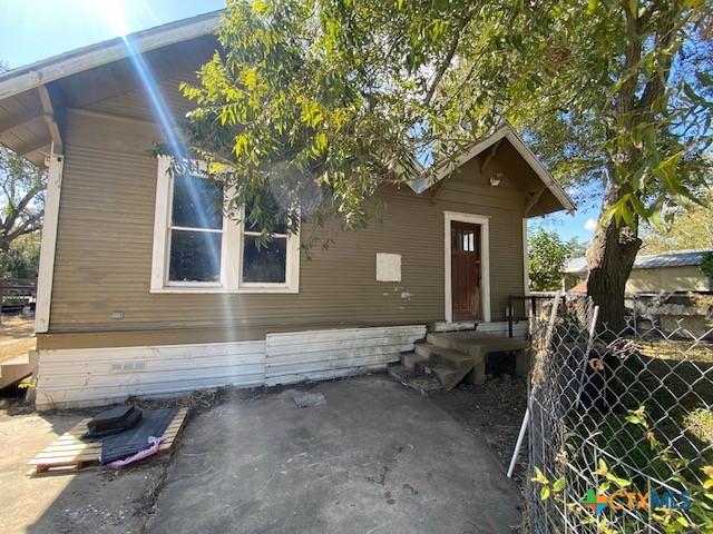 409 E Hochheim St, Yoakum, TX 77995 - view of front of house featuring a patio