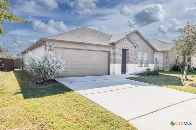 ranch-style home with a front yard and a garage