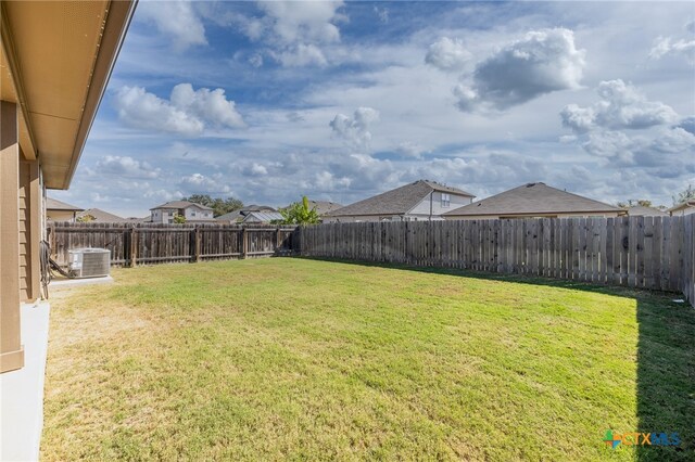 view of yard with central AC