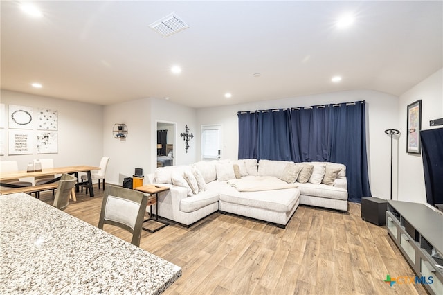 living room with light hardwood / wood-style flooring