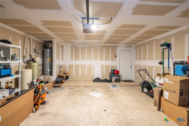 garage featuring electric water heater and a garage door opener