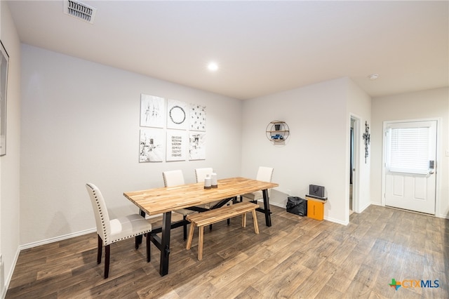 dining space with hardwood / wood-style floors