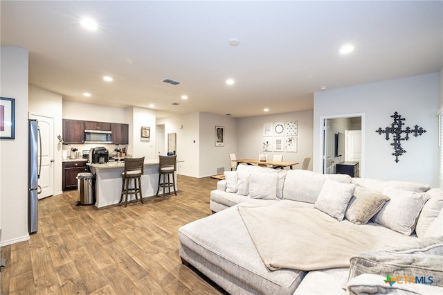 living room featuring light wood-type flooring