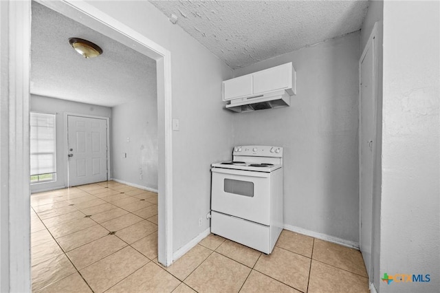 kitchen featuring electric stove, white cabinetry, a textured ceiling, and light tile patterned flooring