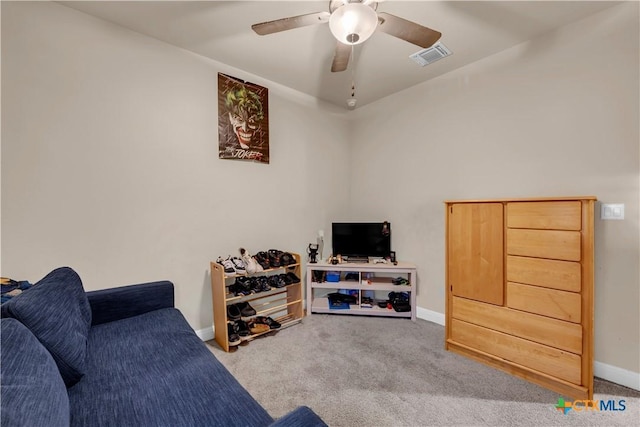 interior space with light carpet and ceiling fan