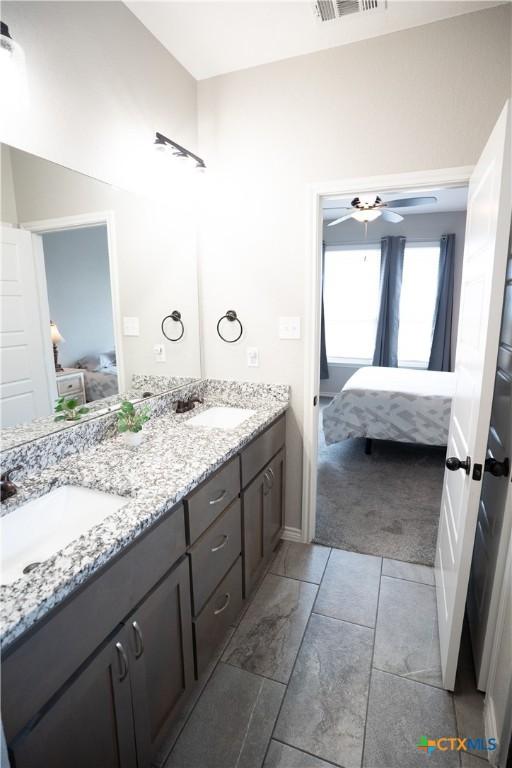 7709 Purvis St, Temple, TX 76502 - ensuite bathroom with double vanity and ceiling fan