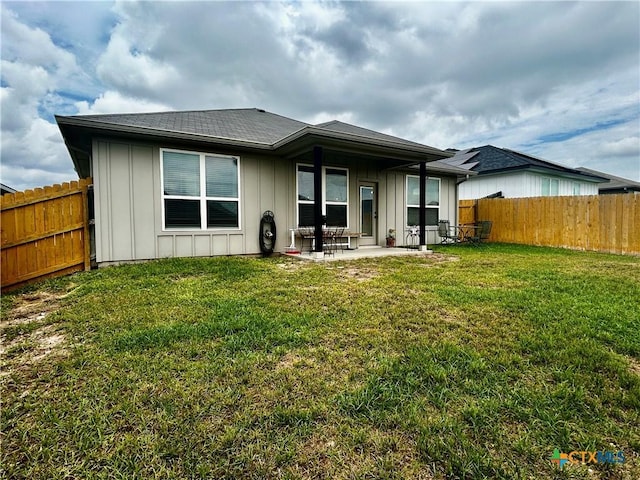7709 Purvis St, Temple, TX 76502 - back of property featuring board and batten siding, a patio, and a shingled roof