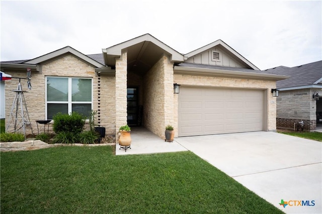 7709 Purvis St, Temple, TX 76502 - view of front of house featuring board and batten siding, driveway, stone siding, a front lawn, and an attached garage