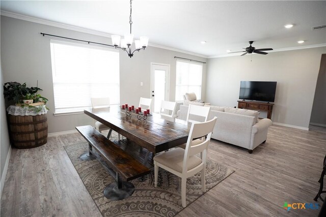 7709 Purvis St, Temple, TX 76502 - dining area featuring crown molding, light wood-type flooring, a chandelier, baseboards, and recessed lighting