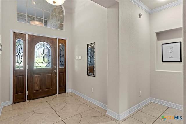 402 Prospector Trl, Harker Heights, TX 76548 - foyer featuring crown molding, light tile patterned floors, and a high ceiling