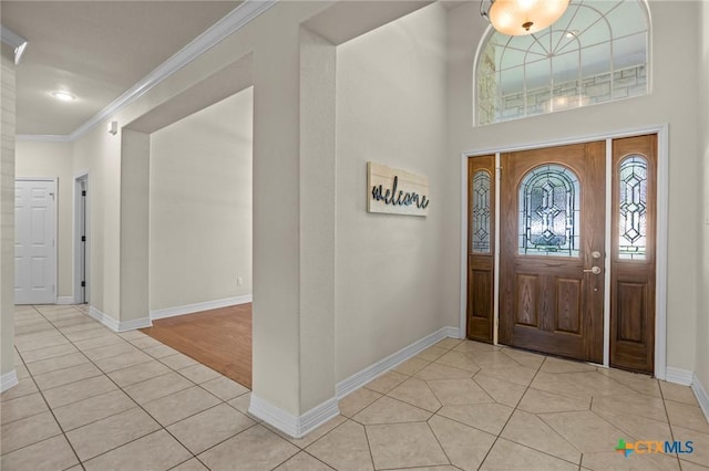 402 Prospector Trl, Harker Heights, TX 76548 - foyer featuring light tile patterned flooring and crown molding
